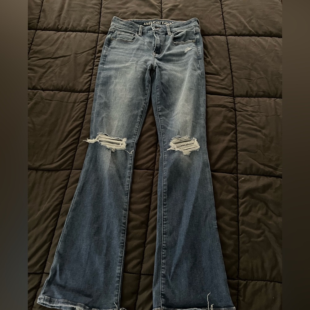 High waist distressed, boot cut jeans.